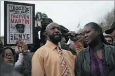  ?? JOHN MOORE GETTY IMAGES ?? Tracy Martin and Sybrina Fulton, parents of slain teenager Trayvon Martin, say the family is “looking for justice – the same justice anyone would expect if their son were shot and killed for no reason.”