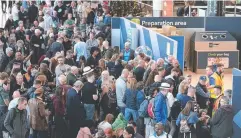  ?? Picture: AP ?? FRUSTRATED: Thousands of passengers wait at Gatwick.