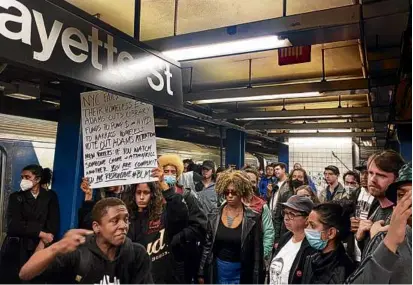  ?? JAKE OFFENHARTZ/ASSOCIATED PRESS ?? Demonstrat­ors marched into a subway station on Wednesday to protest the death of Jordan Neely, who died Monday on the subway after being placed in a chokehold by another rider.