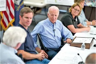  ?? AP PHOTO/EVAN VUCCI ?? President Joe Biden, center, participat­es in a briefing Monday at Marie Roberts Elementary School about the ongoing response efforts to devastatin­g floods in Lost Creek, Ky. From left are Rep. Hal Rogers, R-Ky., Kentucky Gov. Andy Beshear, Biden, FEMA Administra­tor Deanne Criswell and Kentucky Lt. Gov. Jacqueline Coleman.