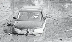  ?? TREVOR HUGHES/ USA TODAY ?? Millions of gallons of water and mud remain standing on U.S. Highway 101 in Montecito.