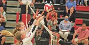  ?? Daniel Bell ?? Alley Cole, left, and Abby Chambers team up to block a shot back across the net on Tuesday.