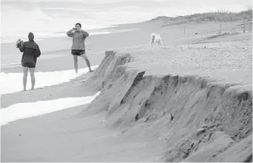  ?? JOE CAVARETTA/SOUTH FLORIDA SUN SENTINEL ?? Beach erosion caused by waves from Hurricane Dorian is seen at Jupiter Beach Park on Tuesday.