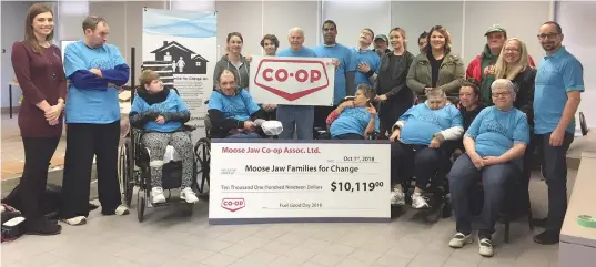  ??  ?? Moose Jaw Families for Change workers and clients accept a cheque for $10,119 from the Moose Jaw Co-Op, proceeds from the Co-Op’s annual good fuel days.