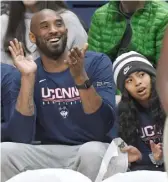  ?? JESSICA HILL/AP ?? Kobe Bryant and daughter Gianna watch the UConn women’s game last season against Houston in Storrs, Conn. Gianna wanted to play at UConn.