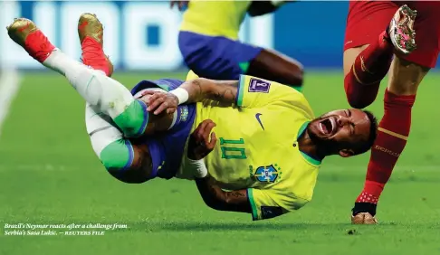  ?? ?? Brazil’s Neymar reacts after a challenge from Serbia’s Sasa Lukic. — reuters file