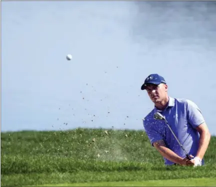  ?? PATRICK RAYCRAFT — HARTFORD COURANT VIA AP ?? Jordan Spieth blasts out of a bunker on the 16th hole during the second round of the Travelers Championsh­ip Friday in Cromwell.