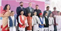  ?? —DC ?? Children dressed as eight Gnyanpith awardees of Karnataka pose with deputy head mission of Spanish embassy, Eduardo Sanchez Moreno (third from left), cultural attache, Ignacio Vitorica Hamilton (second from left), chief secretary S.P Singh (centre) and artist Sonal Mansingh (left) at the Hyderabad Literature Festivalon Friday.