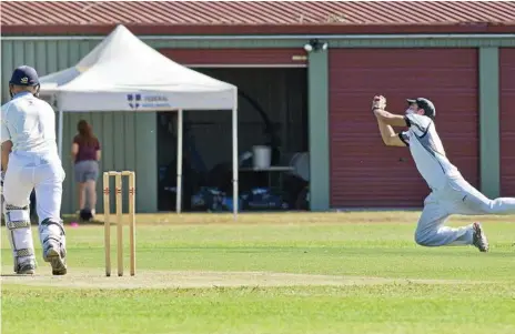  ??  ?? WHAT A CATCH: Mark Henning of Southern Districts takes a screamer in the field to dismiss Western Districts’ Samuel Thompson at Middle Ridge Park on Saturday.