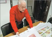  ?? PHOTOS BY DING LUYANG / CHINA DAILY ?? Kong Xiangming displays part of his postcard collection at his home in Changchun, Jilin province.