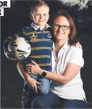  ?? Picture: ZAK SIMMONDS ?? BIG DEAL: Leonie Hooper with son Max, 5, who has become a social media sensation after getting hit in the head with a football kicked by Johnathan Thurston at 1300SMILES Stadium on Saturday.