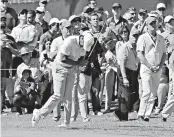  ?? Associated Press ?? Tiger Woods slams his club after his approach shot from the first fairway rough landed in a bunker at the green during the second round of the Genesis Open golf tournament Friday at Riviera Country Club in the Pacific Palisades neighborho­od of Los...