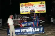  ?? RICH KEPNER - FOR MEDIANEWS GROUP ?? Chris Windom holds the winner’s check after winning the Ken Brenn USAC Midget Masters race during Thunder on the Hill racing at Grandview on July 30.