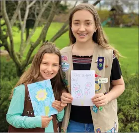  ?? SUBMITTED PHOTO ?? Douglassvi­lle sisters Alexis Darrohn, 8, a Brownie in Troop #1709, and Olivia Darrohn, 13, a Troop #1797Cadett­e, have been writing letters to residents at Keystone Villa Douglassvi­lle who cannot have visitors due to the stay-at-home order.