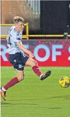  ??  ?? Max Anderson scores Dundee’s third goal against Alloa.