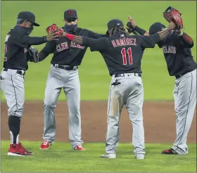  ?? AARON DOSTER — THE ASSOCIATED PRESS ?? Francisco Lindor Cesar Hernandez, Carlos Santana and Jose Ramirez celebrate after the indians’ 4-2 win over the Reds on Aug. 4.