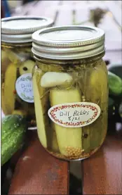  ?? GRETCHEN MCKAY — PITTSBURGH POST-GAZETTE — TNS ?? Easy refrigerat­or dill pickles start with fresh pickling cucumbers, which are widely available at farmers markets in late summer.
