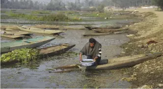  ??  ?? SRINAGAR: A Kashmiri villager collects water to wash his boat at the Wular Lake, northeast of Srinagar, Indian controlled Kashmir. India has realized a vast, alpine lake in Kashmir would be worth more pristine than exploited for resources. —AP
“The...
