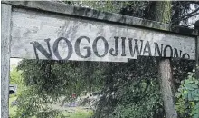  ?? CLIFFORD SKARSTEDT EXAMINER FILE PHOTO ?? The Nogojiwano­ng sign at Millennium Park has fallen into disrepair.