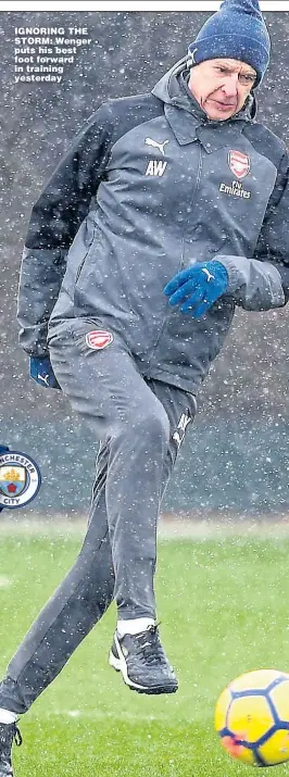  ??  ?? IGNORING THE STORM: Wenger puts his best foot forward in training yesterday