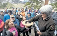  ?? Helen H. Richardson, Denver Post file ?? Rocky Mountain National Park volunteer Karen Morse, right, pulled names out of a hat for the backcountr­y camping permits drawing at the Rocky Mountain National Park Wilderness Office last March. That process “will look a little different this year, due to COVID,” according to park spokeswoma­n Kyle Patterson. Details have not been finalized yet.