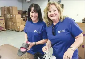  ?? Contribute­d Contribute­d ?? Kelowna-based Capri Insurance made a best workplaces in Canada list for its employee share options and volunteer opportunit­ies. Pictured here, Capri employees Paula Garrecht, left, and Cheryl Judson lend a hand at Shoe Bank Canada in Kelowna.