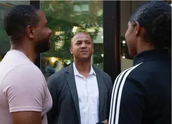  ?? AMAnDA sAbgA / boston HerAlD ?? BARROS: Candidate for mayor of Boston John Barros chats with Tony Baptiste, of Quincy, and his daughter Andrea during a meetup hosted by Boston Wealth Builders at The Pearl restaurant on Sunday in Dorchester.