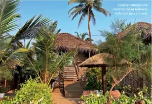  ?? ?? Luxury cottages are constructe­d in Balinese style and face the sea.