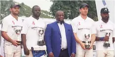  ??  ?? Craig James of South Africa (left), Khalifa Ibrahim, Ambassador Idaere Gogo- Ogan, Leiruex Hendriks of South Africa and Lukeman Adebayo pose with the Access Bank Cup at the end of the competitio­n in which Swiss Internatio­nal team defeated Old Mutual in...