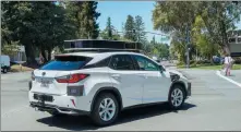  ?? ANDREJ SOKOLOW / AP ?? A Lexus equipped with Apple technology drives itself through Silicon Valley in May.