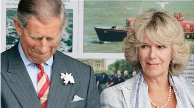  ?? S E G A M I Y TT E G / M A H R G M TI : e r u t c i P ?? Don’t make me laugh: Wicked Camilla gives Charles a fit of the giggles at a 2005 lifeboat launch
