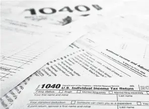  ?? KEITH SRAKOCIC/ AP FILE ?? Nearly 7 million tax filers who await their tax refunds face significant delays this tax season as the IRS rushes to send out stimulus checks.