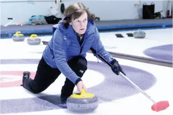  ?? CITIZEN FILE PHOTO ?? Jackie Burns throws a rock during a bonspiel at the Prince George Golf and Curling Club in January 2017.