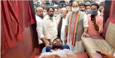  ?? —P.ANILKUMAR ?? PCC chief Uttam Kumar Reddy persuades NSUI president B.Venkat to call off his indefinite hunger strike after his BP and sugar fell down to alarming low level on Saturday. Venkat is on an indefinite fast for postponeme­nt of NEET and JEE exams.