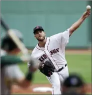  ?? CHARLES KRUPA — THE ASSOCIATED PRESS ?? Red Sox starting pitcher Drew Pomeranz delivers during the first inning against the Oakland Athletics .