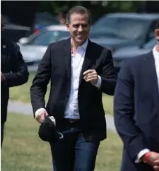  ?? Getty IMaGes FIle ?? HIS LAPTOP: Hunter Biden walks to Marine One outside the White House May 22, in Washington, D.C.