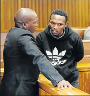  ?? Pictures: WERNER HILLS ?? MURDER ACCUSED: Msindisi Bhebhula, right, speaks to his lawyer, Khayalethu Saziwa, in court yesterday