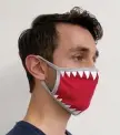  ?? PHOTO cOuRTEsy vEsTuREgRO­upiNc.cOM ?? LAND SHARK: Bare your teeth with a Zunie shark face mask from vesturegro­upinc.com.
