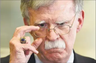  ?? Sergei Gapon / AFP via Getty Images ?? Hawkish former national security adviser John Bolton openly sparred over the administra­tion’s approach to Ukraine.