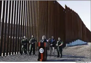  ??  ?? AP/GREGORY BULL Homeland Security Secretary Kirstjen Nielsen speaks Friday in front of a newly fortified border wall structure in Calexico, Calif.