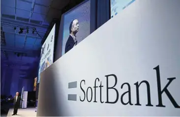  ??  ?? Ride-hailing deal: SoftBank Group Corp CEO Masayoshi Son at a SoftBank World presentati­on at a hotel in Tokyo. SoftBank has reached a deal with Uber to invest billions in the ride-hailing giant. — AP