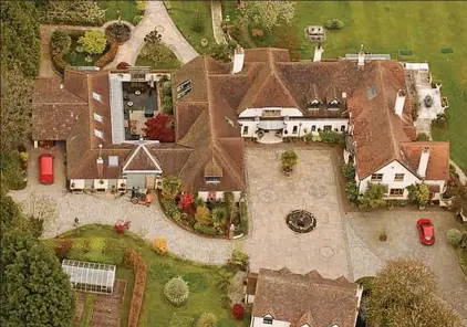  ??  ?? Rooms with a view: Aerial view of Sir Jim’s Hampshire mansion, one of several properties he owns