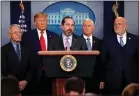  ?? CAROLYN KASTER — THE ASSOCIATED PRESS ?? Health and Human Services Secretary Alex Azar speaks on the coronaviru­s, flanked by NIAID Director Anthony Fauci, President Trump, Vice President Pence and CDC Director Robert Redfield, on Saturday.