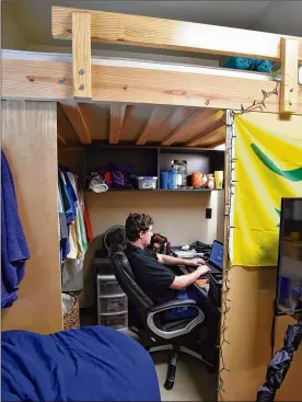  ?? AJC 2016 ?? Georgia Tech student Clark Jacobs hangs out in his room at the Kappa Sigma fraternity house following his return to school after being seriously injured when he fell out of his bunk bed. He still suffers lingering effects.