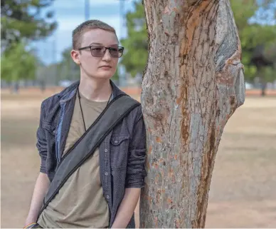  ?? CHLOE JONES/THE REPUBLIC ?? Jakob Hassett stands in Roadrunner Park in Paradise Valley on Nov. 22. They said one of the most impactful parts of One n Ten is that it is a nonprofit for LGBTQ+ people, led by LGBTQ+ people.