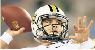  ?? JOSHUA C. CRUEY/ORLANDO SENTINEL ?? UCF quarterbac­k Blake Bortles warms up before the Tostitos Fiesta Bowl on Jan. 1, 2014, in Glendale, Ariz., where he led the Knights to an upset victory over Baylor.