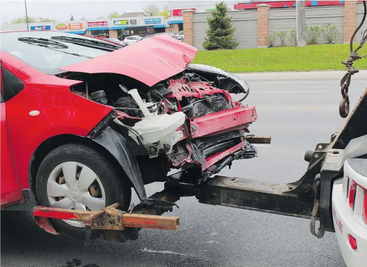  ?? — POSTMEDIA NEWS FILES ?? CarProof reports that the national median collision damage cost is $3,389, and that one of every three vehicles has had some type of bodywork done.