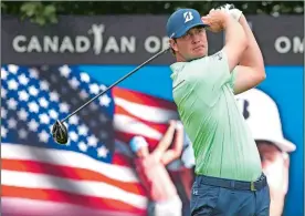  ?? FRANK GUNN/THE CANADIAN PRESS/AP PHOTO ?? Hudson Swafford keeps an eye on his tee shot on the 10th hole during the first round of the PGA Canadian Open on Thursday at Glen Abbey in Oakville, Ontario. Swafford is in a five-way tie for the lead.