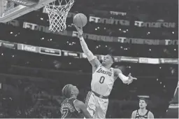  ?? KIRBY LEE/USA TODAY SPORTS ?? Former Lakers guard Russell Westbrook shoots against the Spurs on Jan. 25. The Lakers traded Westbrook to the Jazz and reacquired guard D’Angelo Russell from Minnesota in a three-team deal last week.