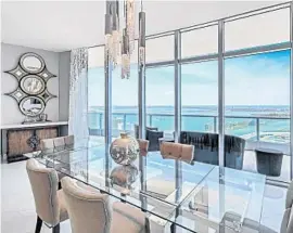  ?? PHOTOS COURTESY MIAMI LUXURY HOMES GROUP AT DOUGLAS ELLIMAN ?? The penthouse has three bedrooms, four full and one-half baths, a private elevator, movie theater, gourmet kitchen, smart-home technology and bay and Miami skyline views.